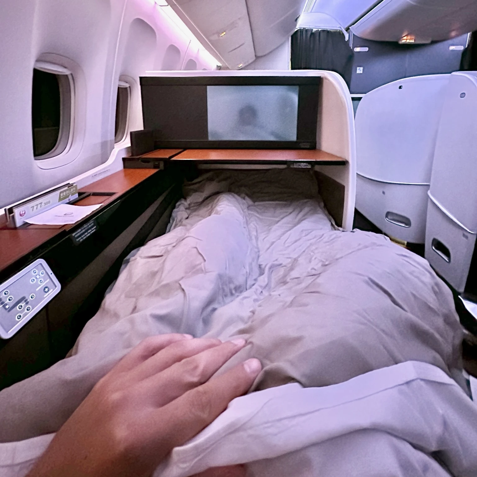 Japan Airlines Boeing 777-300ER First Class has lie-flat beds.