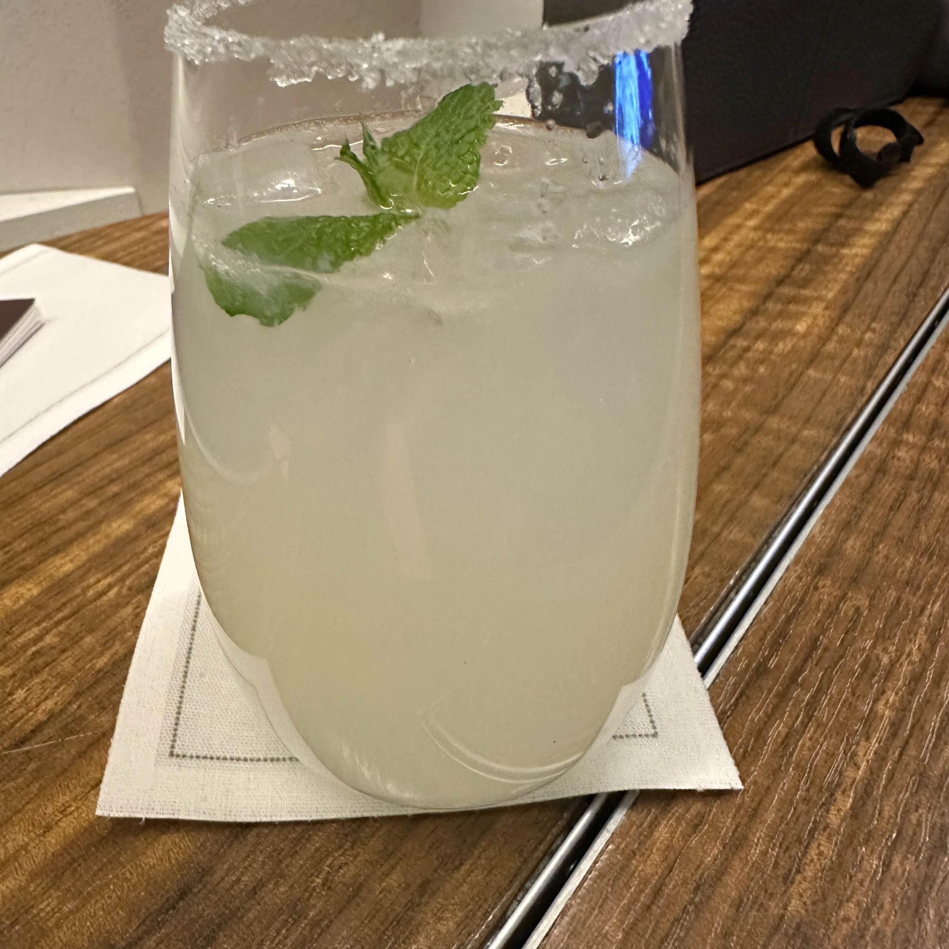 Cathay Pacific First Class signature Cloud Nine cocktail served inflight.