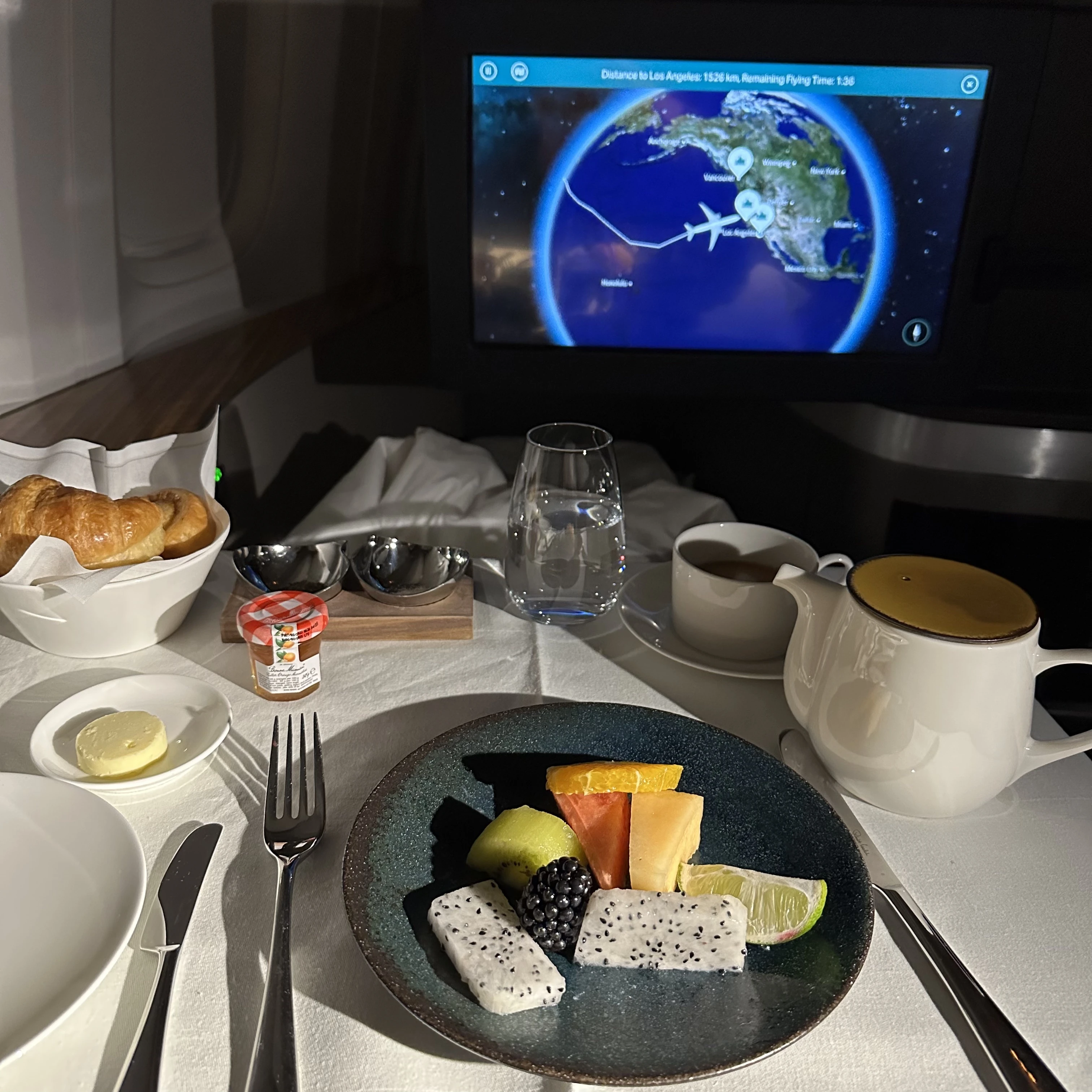 Cathay Pacific First Class breakfast fruit platter with fresh seasonal fruits.