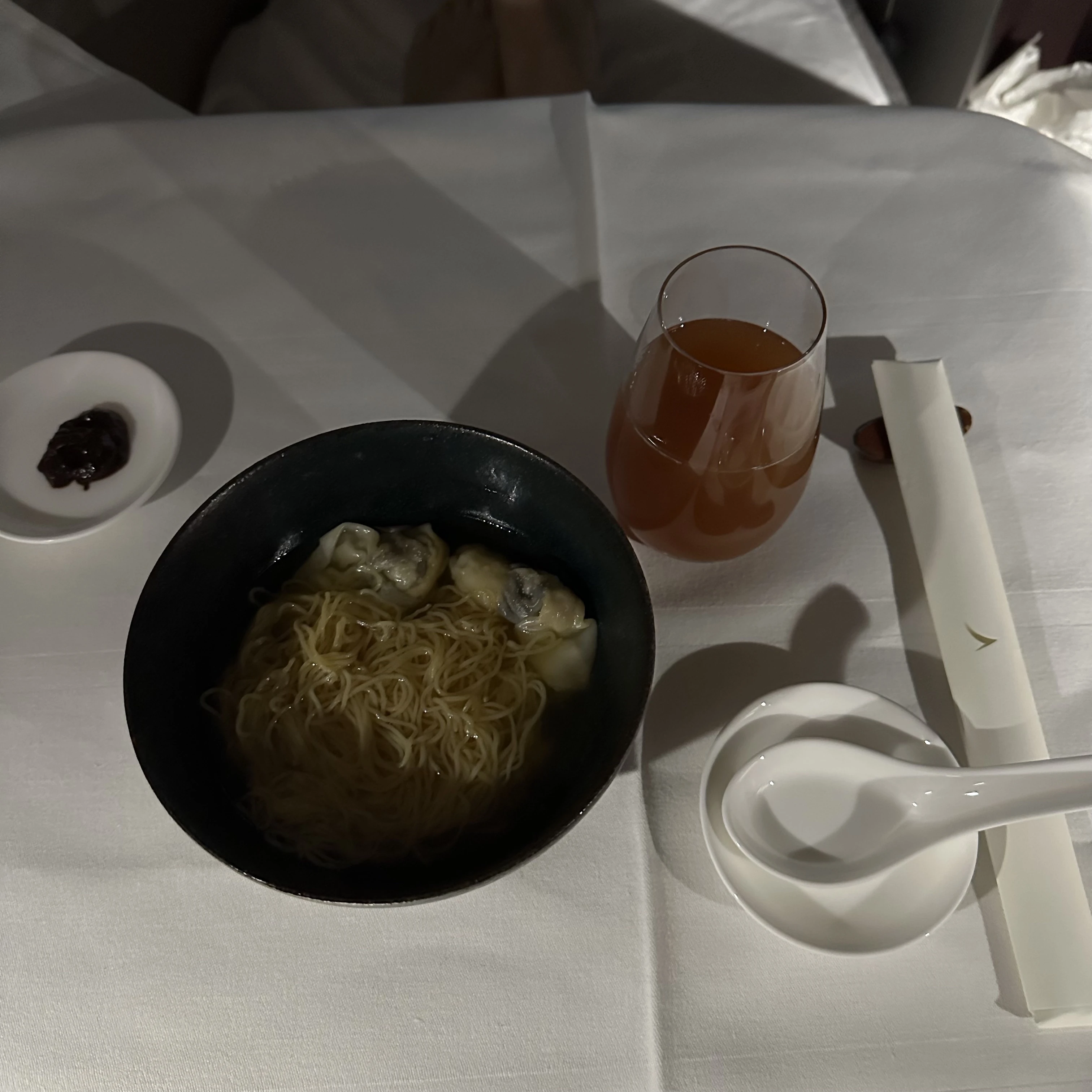 Cathay Pacific First Class wonton noodle soup, a savory inflight snack.