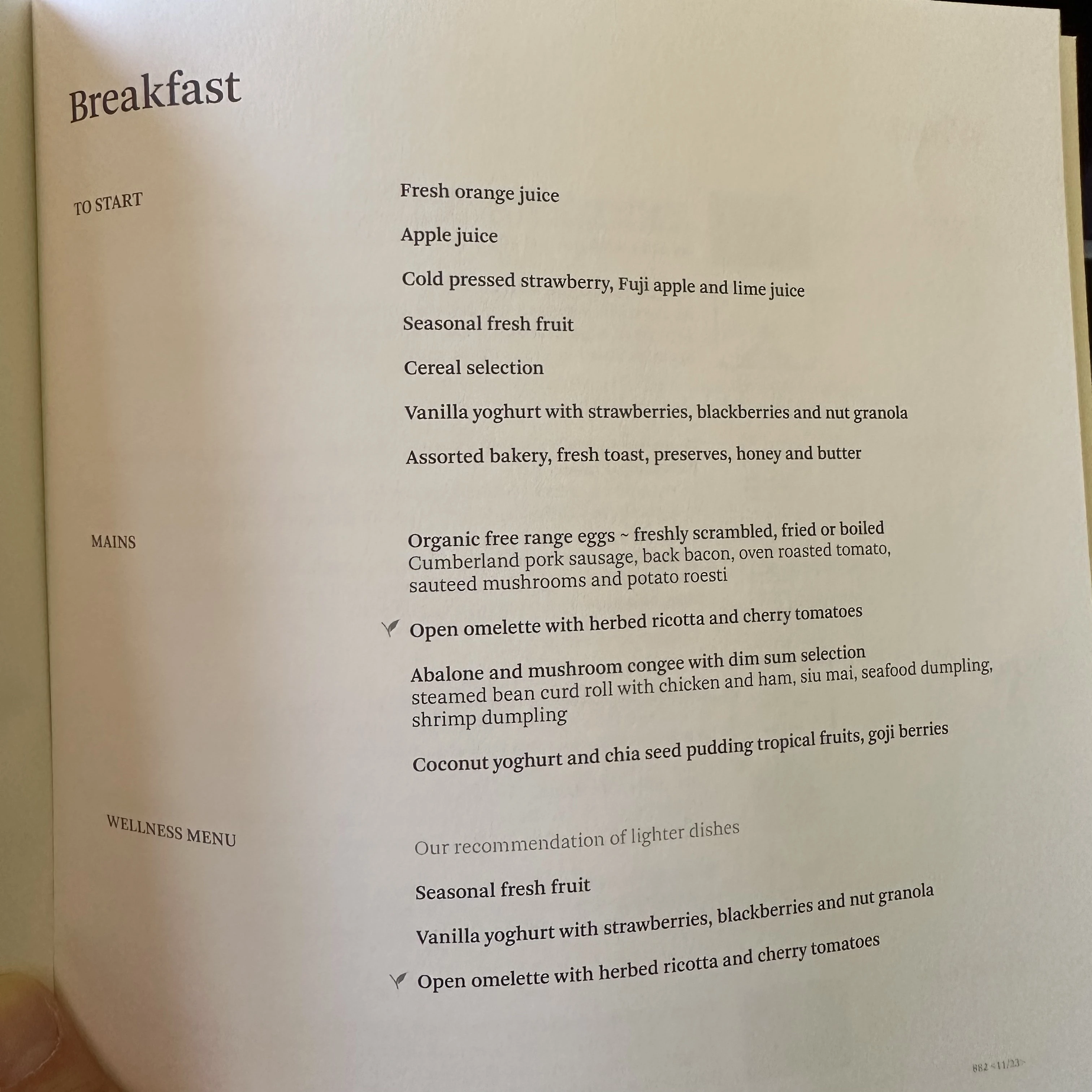 Cathay Pacific First Class breakfast menu with international and Asian options.