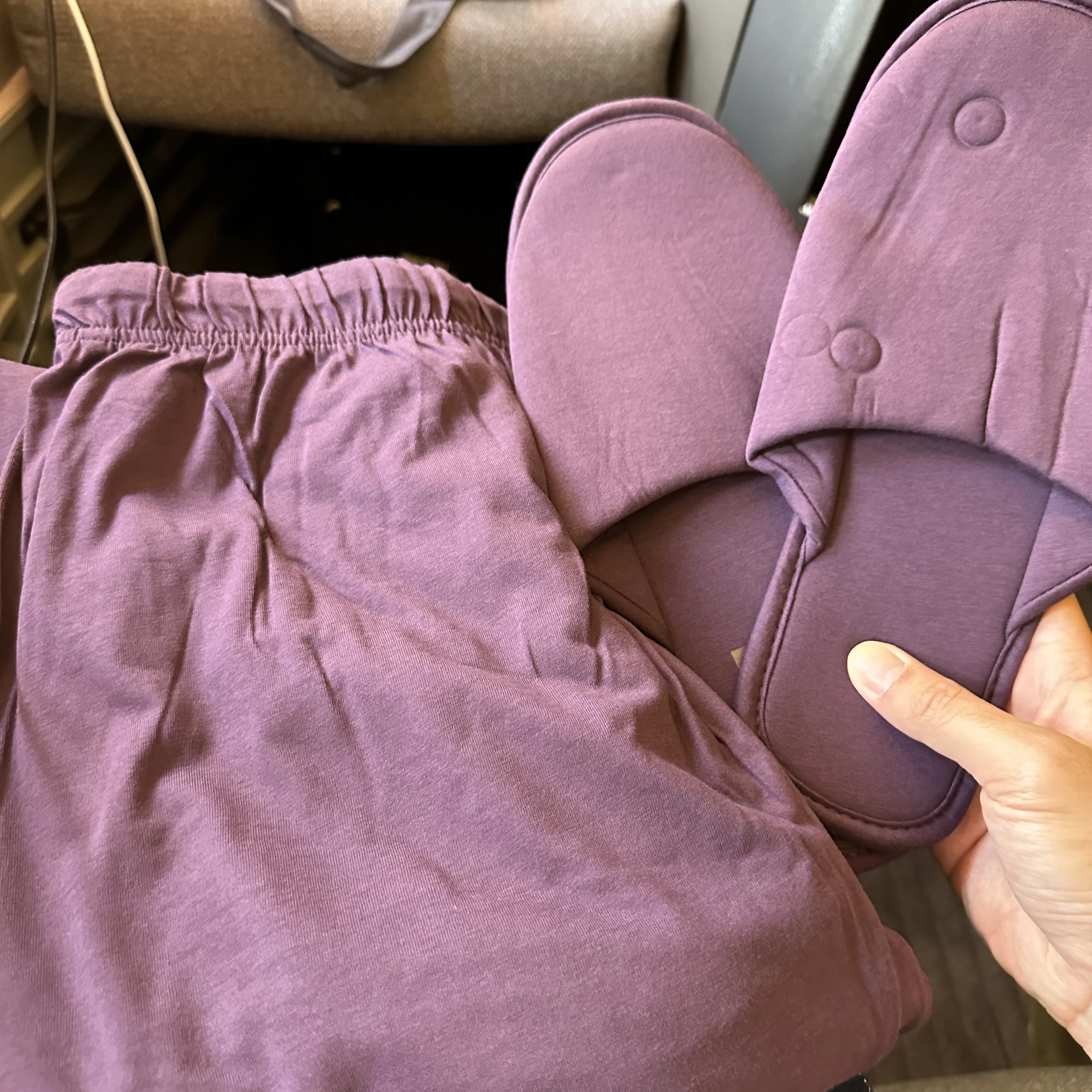 Cathay Pacific Boeing 777-300ER First Class pajamas and slippers.