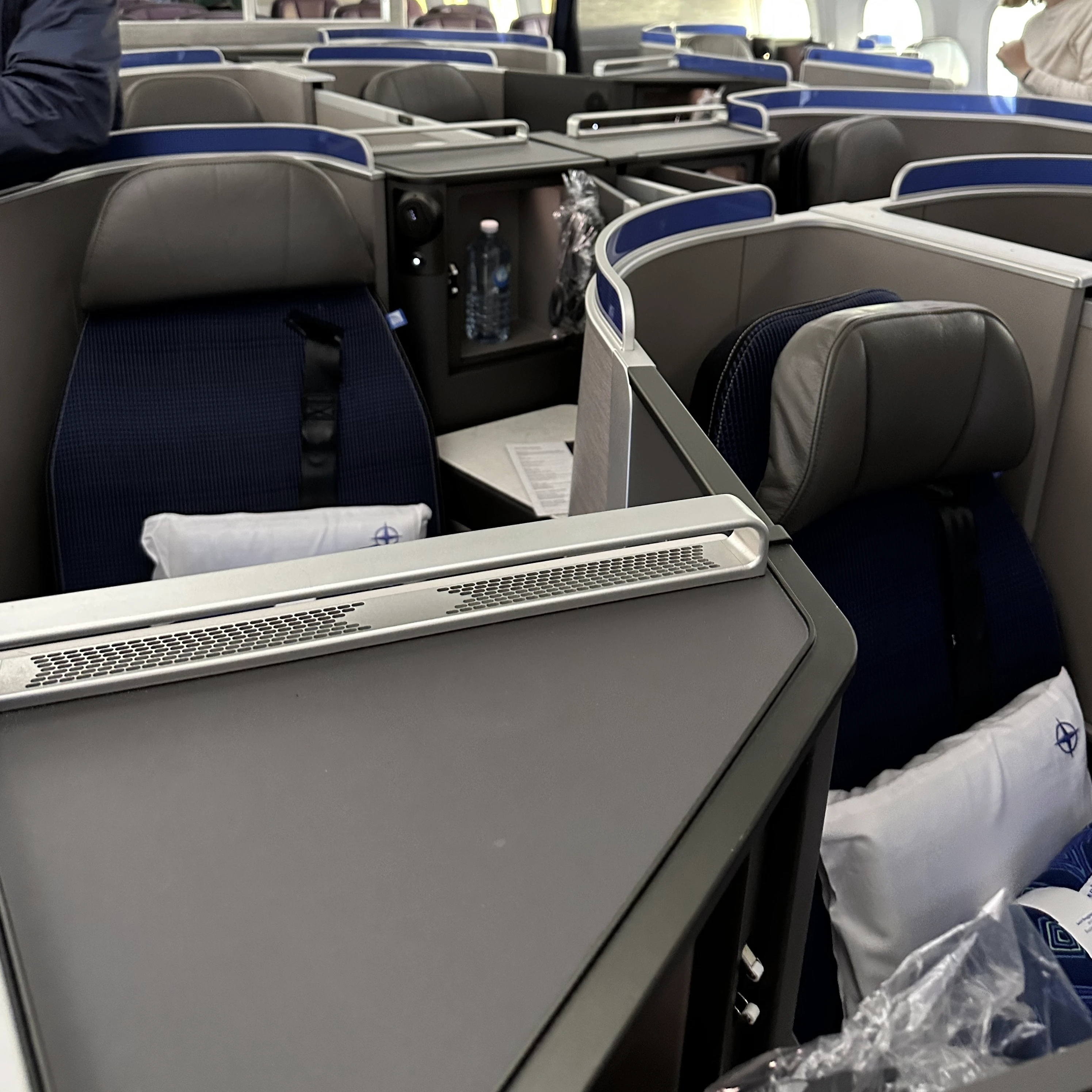 United Boeing 787 Business Class on the Boeing 787-9 featuring a staggered seating layout and a sleek modern design.