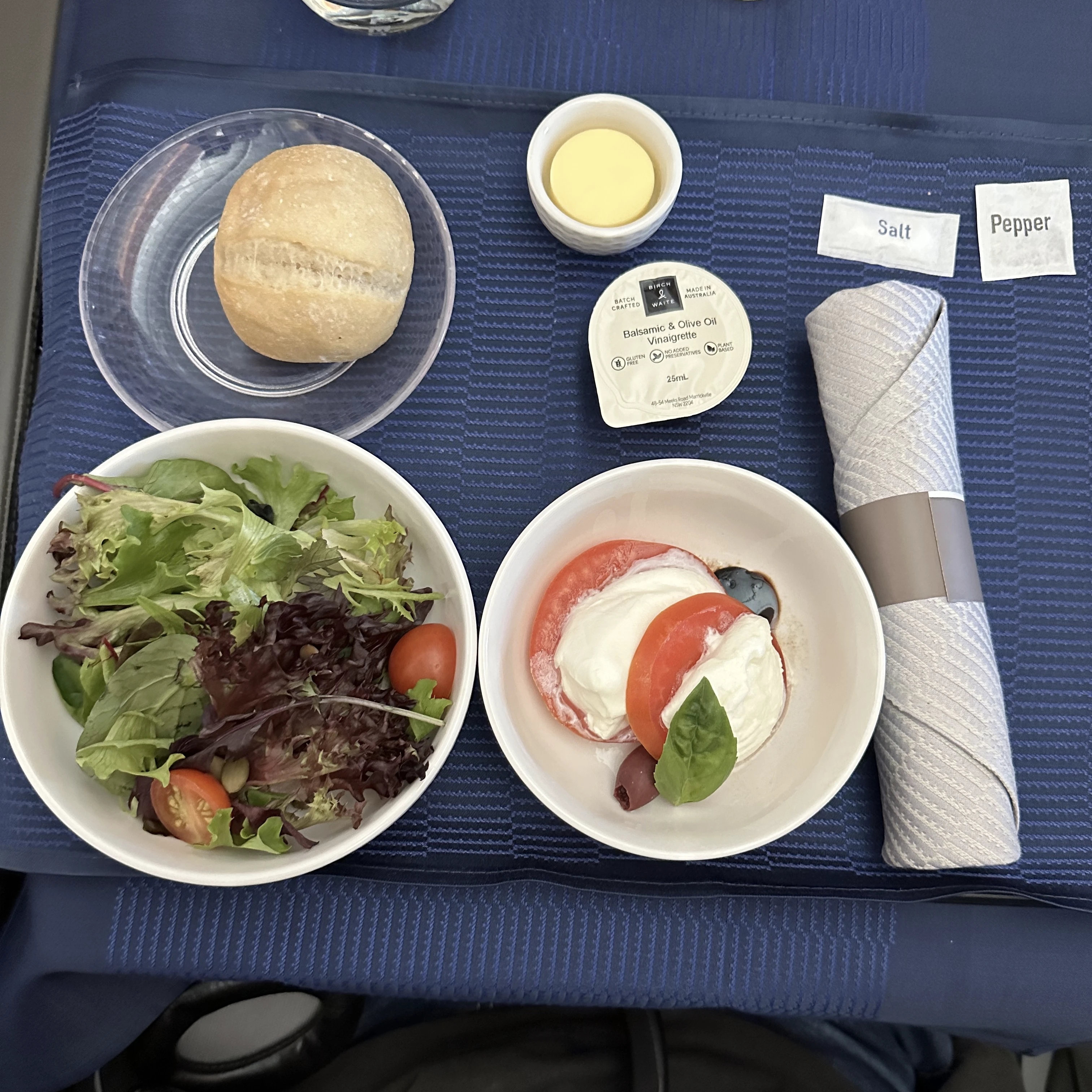 Appetizer served in United Polaris Business Class, presented with basic plating and limited flavor.