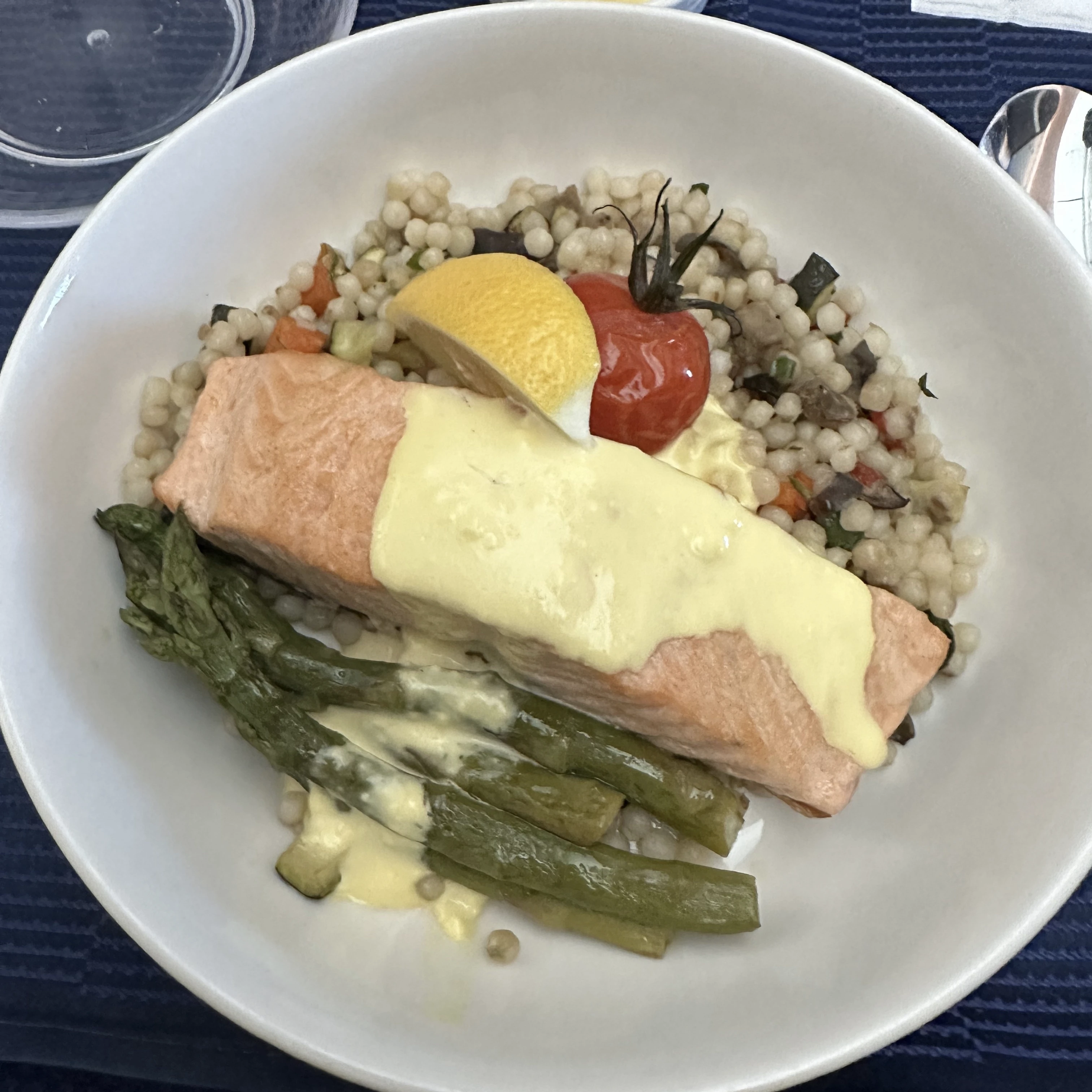 Salmon main entree served in United Polaris Business Class, the most enjoyable dish on the menu