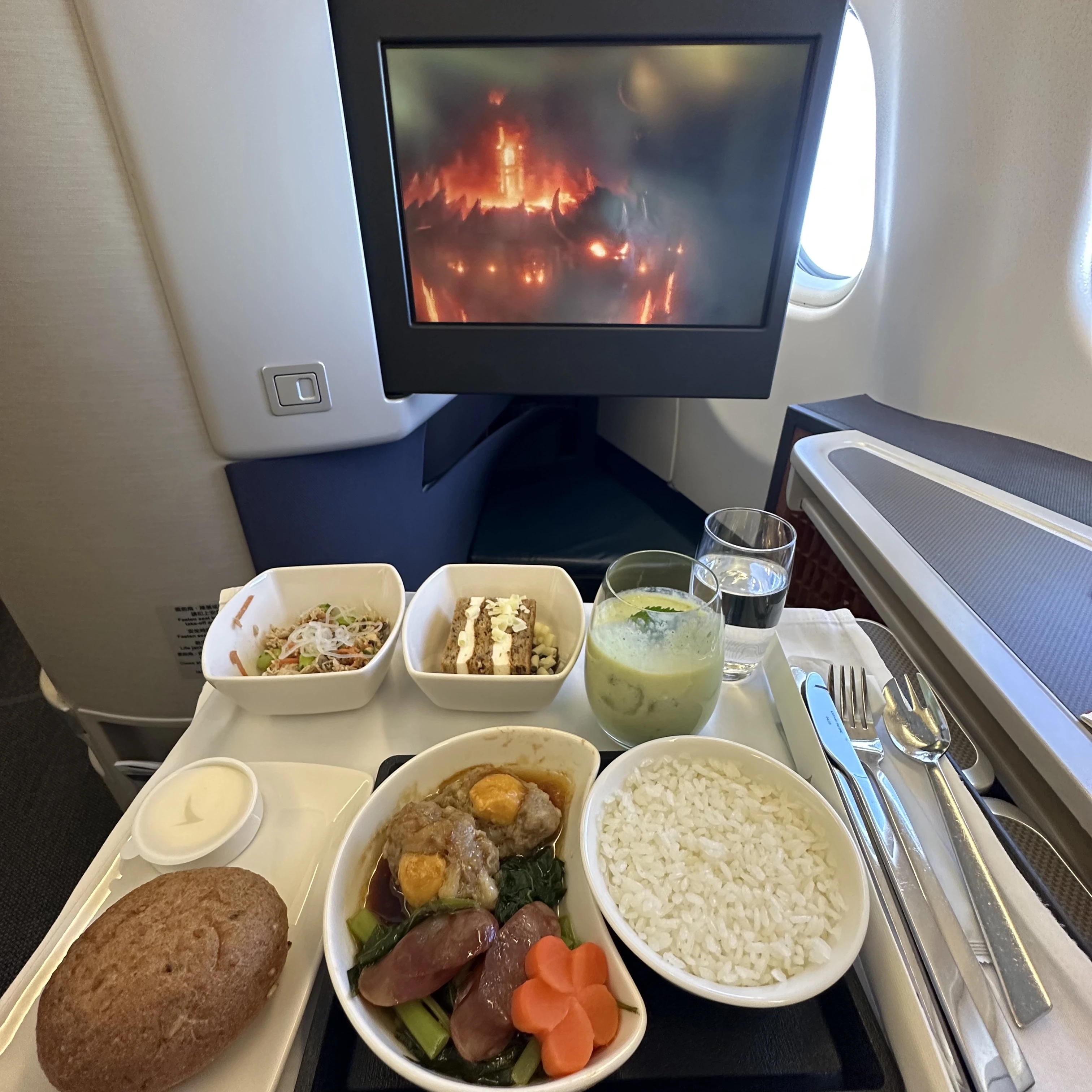 Cathay Pacific Airbus A330-300 business class lunch and TV screen.