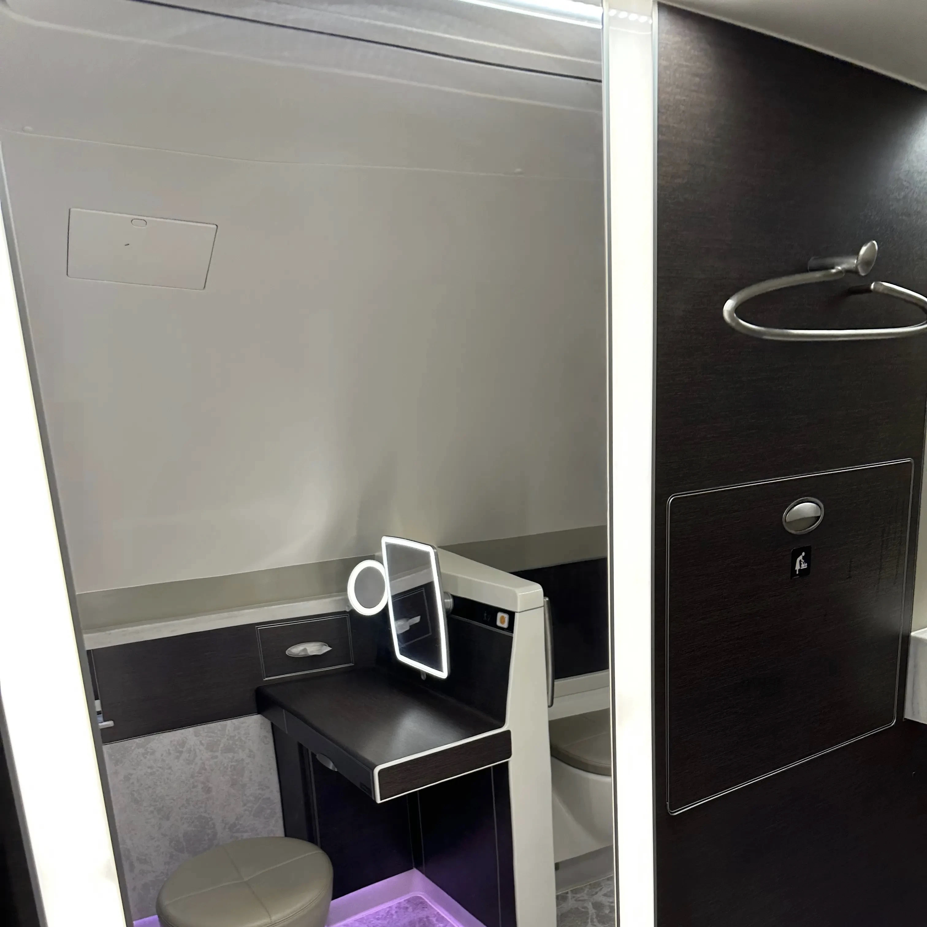 Singapore Airlines A380-800 First Class Suites mirror and hanger.